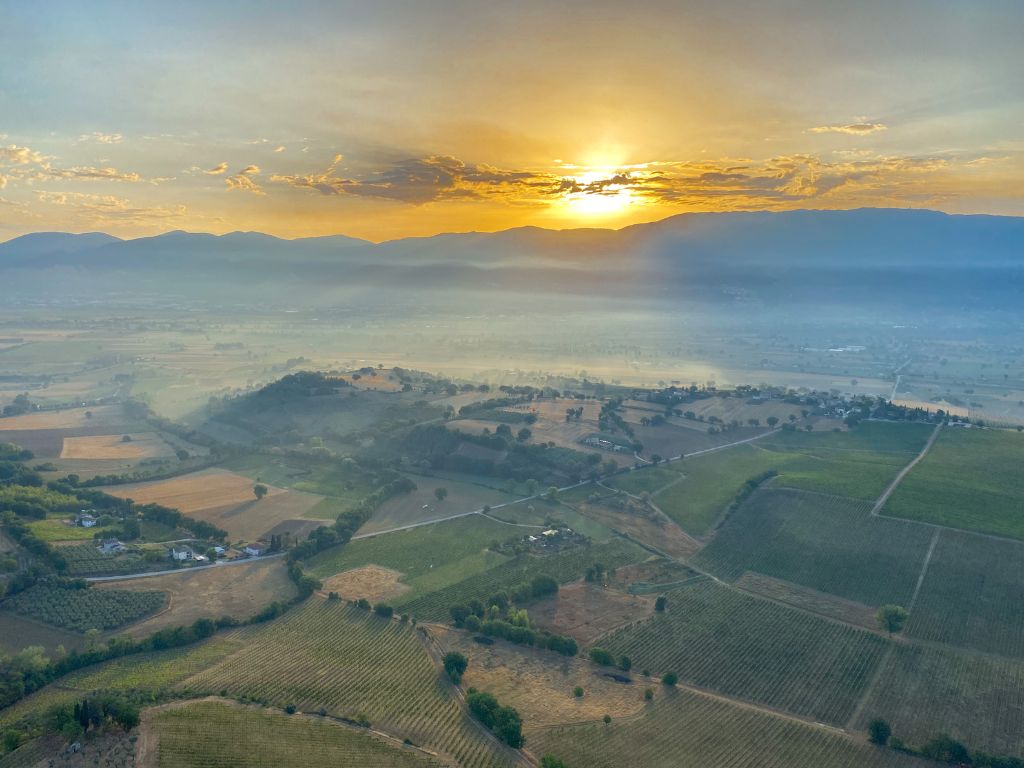 Sunrise in a hot air balloon flight over the Montefalco countryside